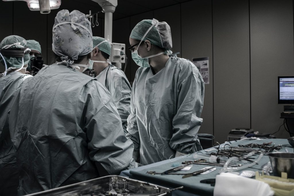 A surgical team in an operating theatre.